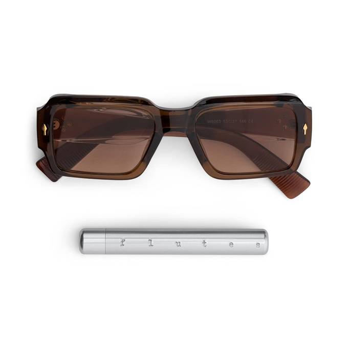 Flutes beside sunglasses